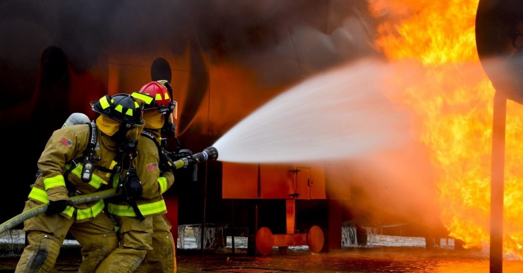 Fire fighters putting out a fire 