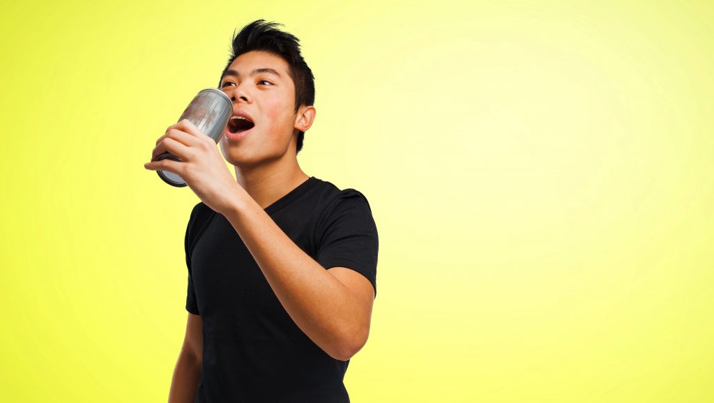 Man drinking from a can