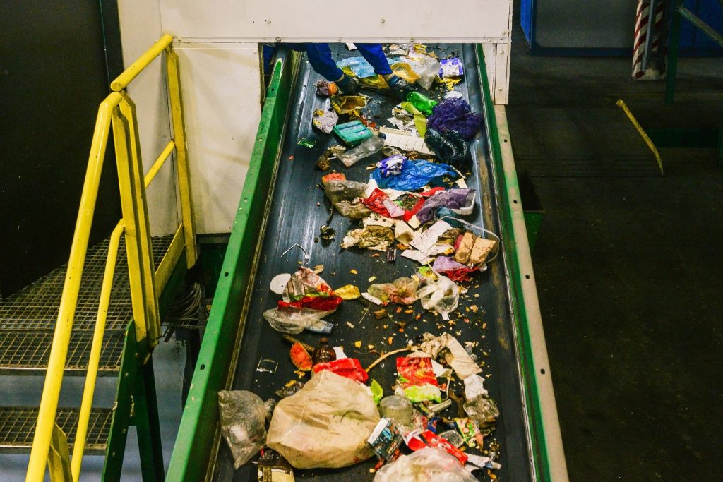 Garbage and Recycling on a conveyor belt being sorted