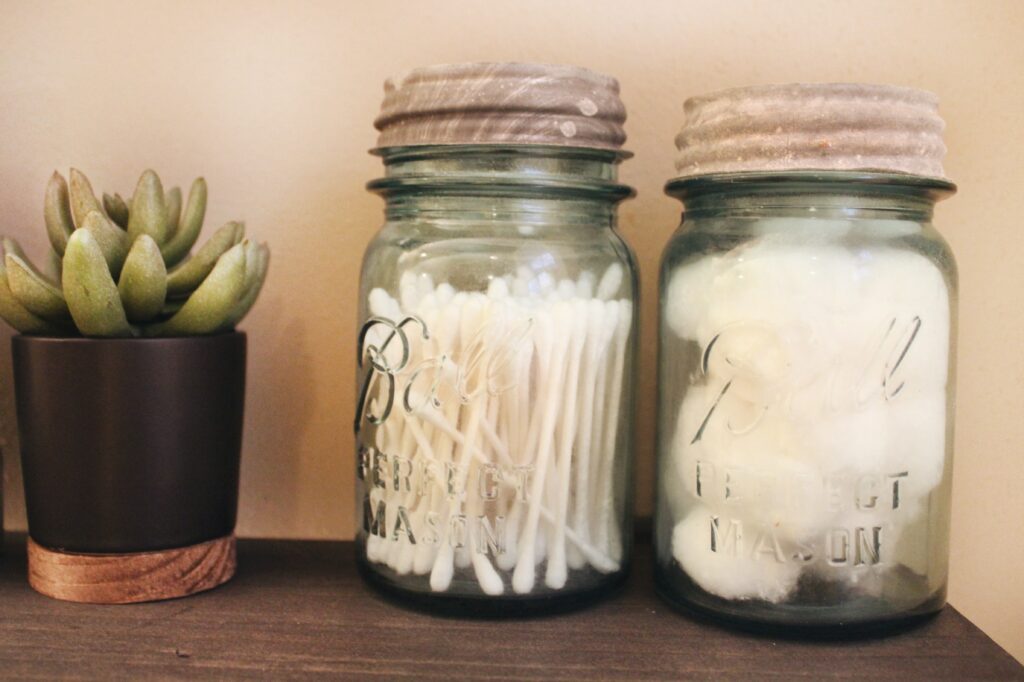 mason jars repurposed as q-tip and cotton ball holders