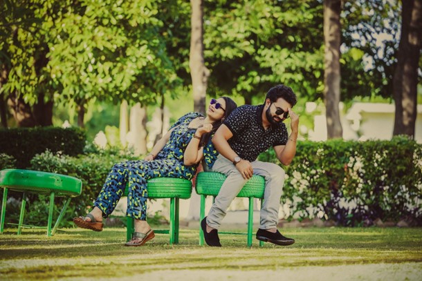 two people sitting on upcycled tires turned into benches