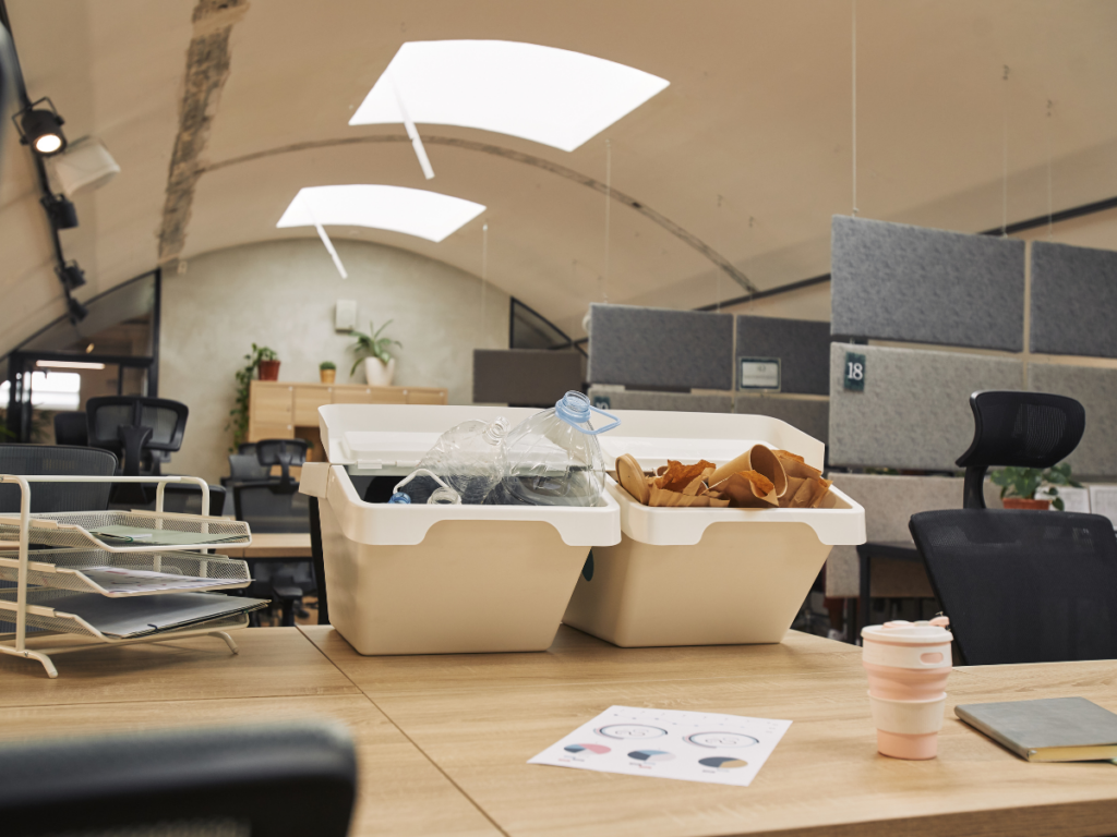 office with two recycling bins on a desk