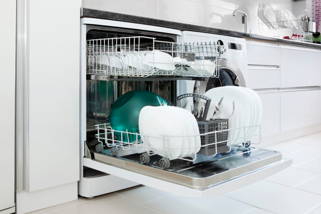 dishwasher open and filled with dishes in a kitchen