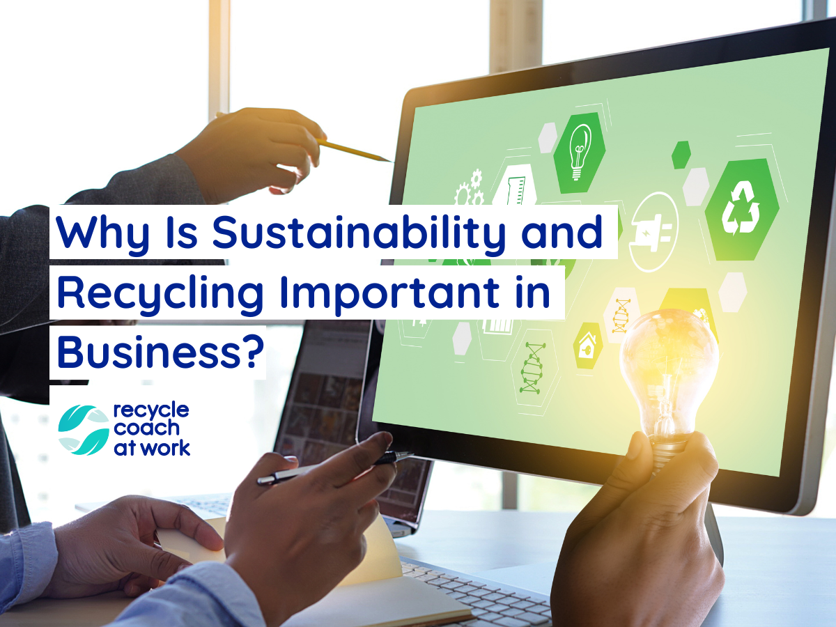 Business people pointing to a computer screen with recycling and sustainability imagery. One hand is holding a light bulb that is lit up