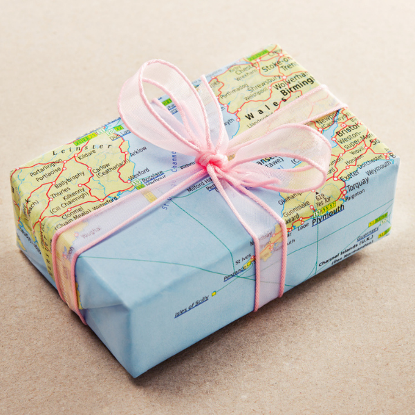 gift wrapped in an old map with ribbon